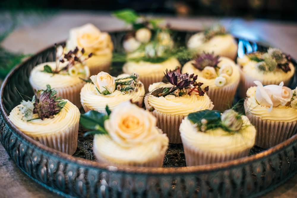 Decorated cupcakes with floral toppings
