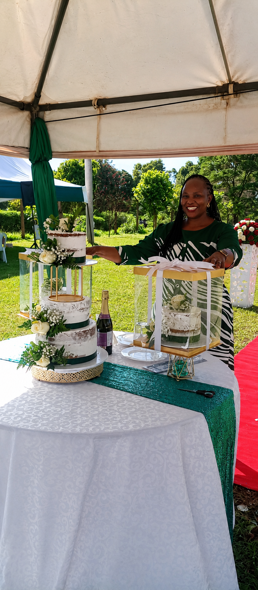 Elegant wedding cake display with gift-boxed cakes